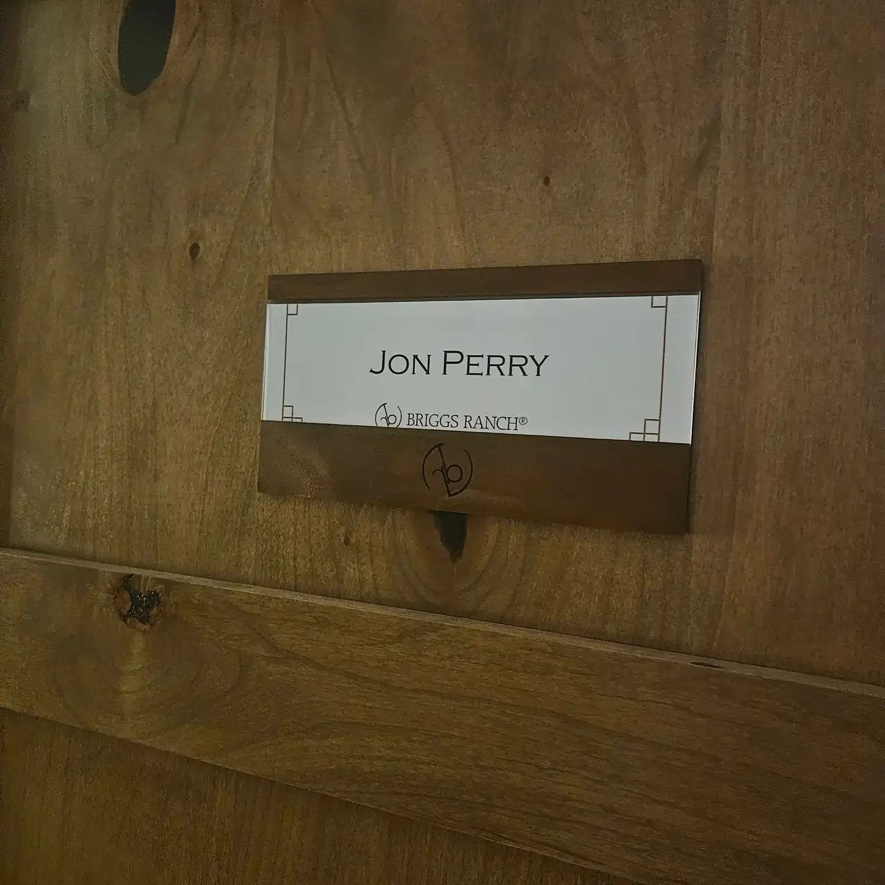 Jon Perry nameplate on a locker at Briggs Ranch Golf Club