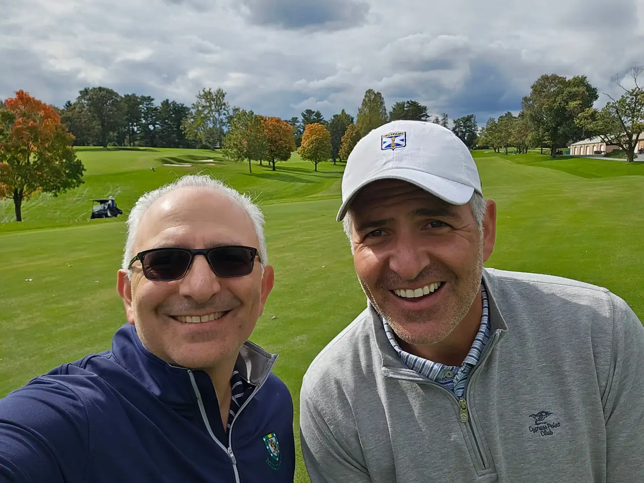 The Perry Bros with fall color behind them at Columbia Country Club