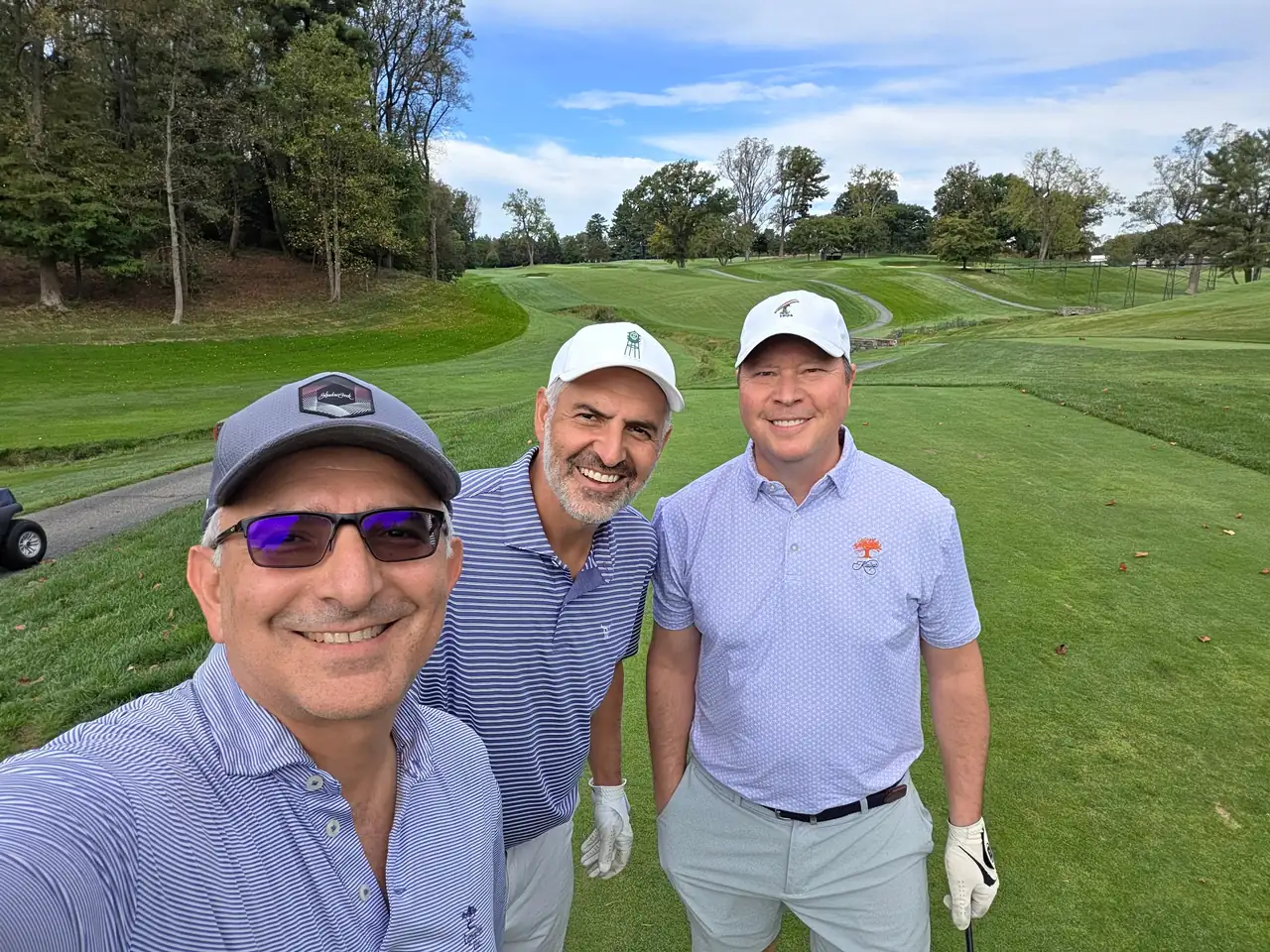 The Perry Bros and a friend on the course at Columbia Country Club