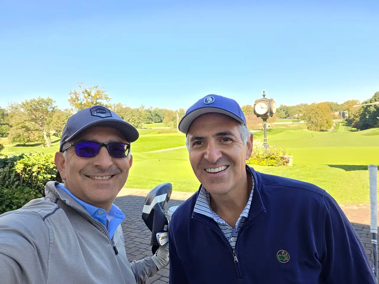 The Perry Bros by a green at Columbia Country Club
