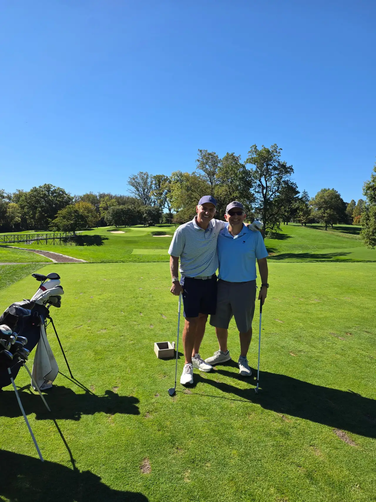 Two golfers on a tee at Columbia Country Club